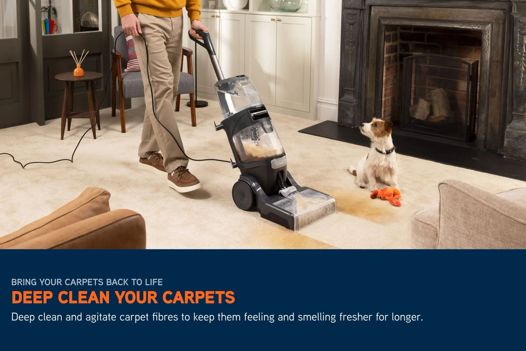 VAX SmartWash XL Advanced Carpet Cleaner removing a pet stain from a cream carpet, with a dog visible in the background. 