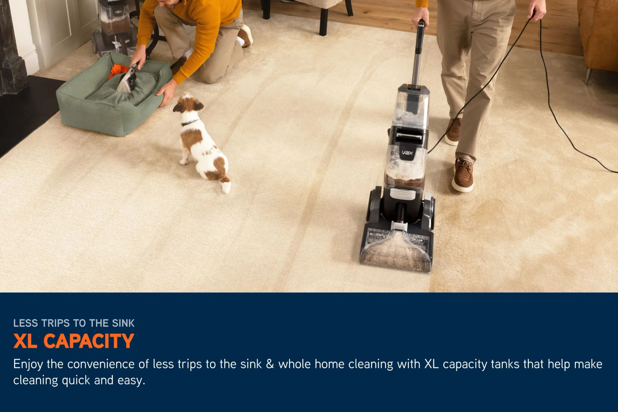 VAX SmartWash XL Advanced Carpet Cleaner being used across a living room, with the main unit cleaning a muddy stain on a cream carpet in the background, and a person using the SpinScrub hand tool to scrub a dog bed in the foreground, with dirty water visi
