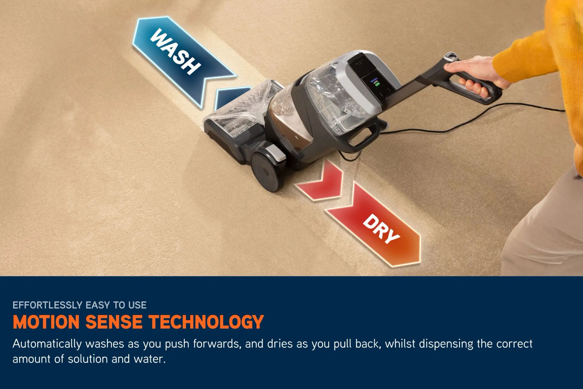 Carpet Cleaner being pushed along a carpet with arrows coming out of it either side to demonstrate how the Carpet Cleaner automatically washes as you push it forwards and dries as you pull back, whilst dispensing the correct amount of solution and water. 