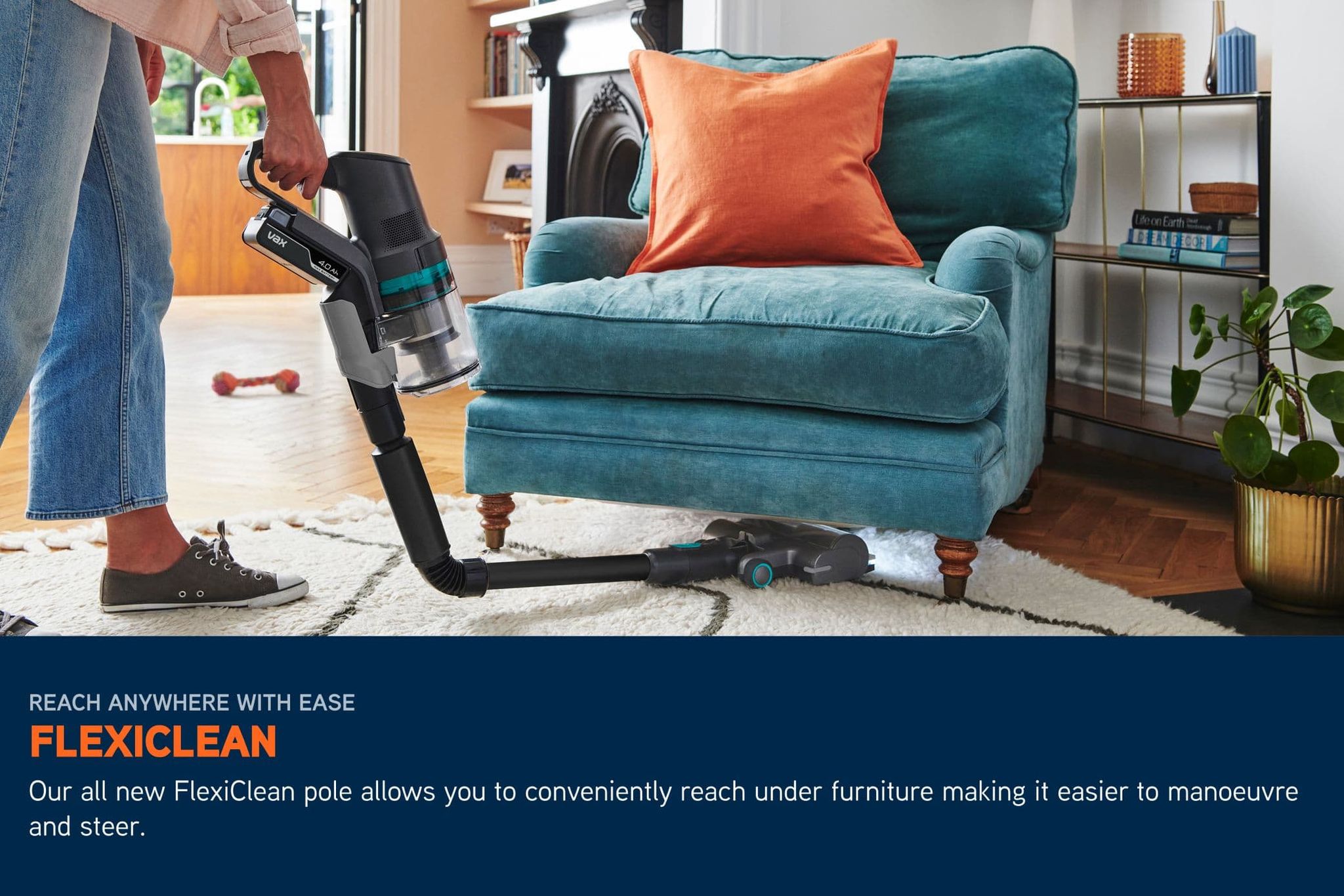 Cordless HomePro Detect Pet-Design vacuum pole bending underneath a chair to clean dirt, with LED lights illuminating the floor beneath