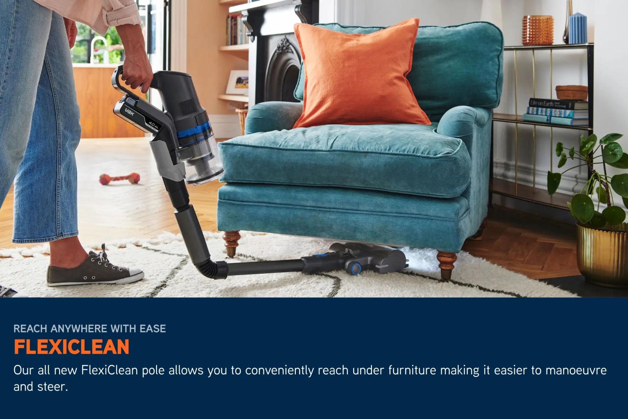 Cordless HomePro Detect Pet vacuum pole bending underneath a chair to clean dirt, with LED lights illuminating the floor beneath