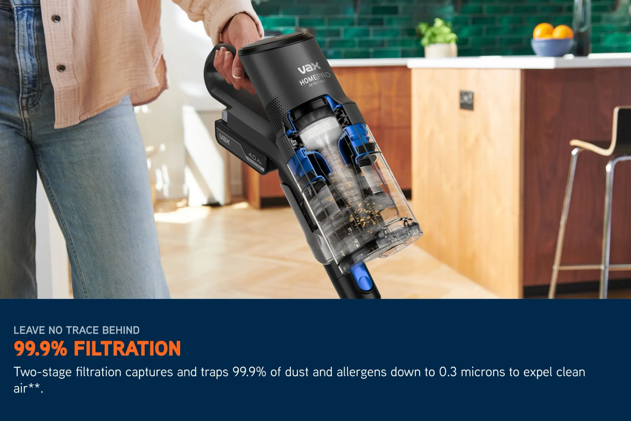 Dirt and crumbs being captured in a HomePro Detect Pet vacuum filter while the vacuum cleaner is in use.