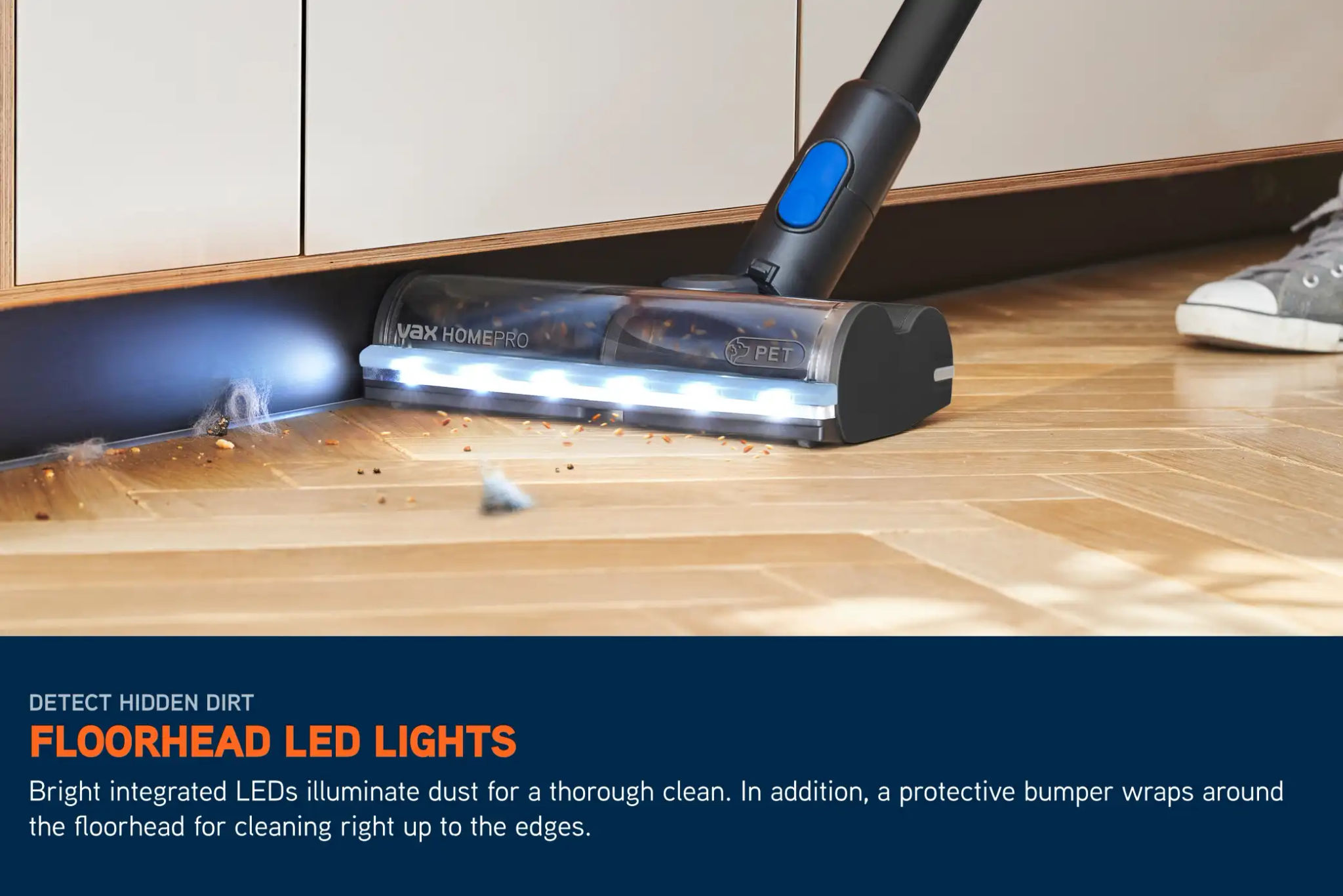 LED lights on a cordless HomePro Detect Pet vacuum illuminating the floor ahead, picking up crumbs and dirt on a hard floor