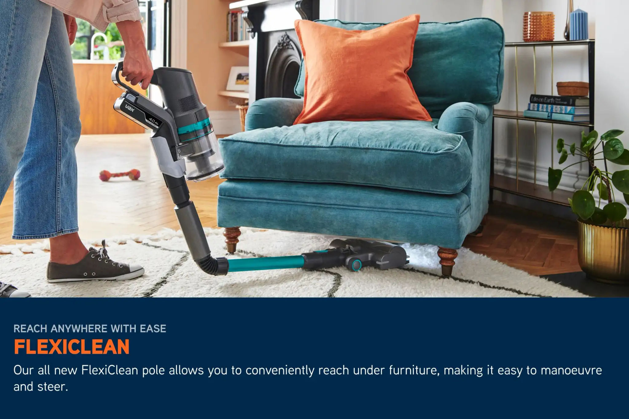 Cordless HomePro Pet-Design vacuum pole bending underneath a chair to clean dirt, with LED lights illuminating the floor beneath