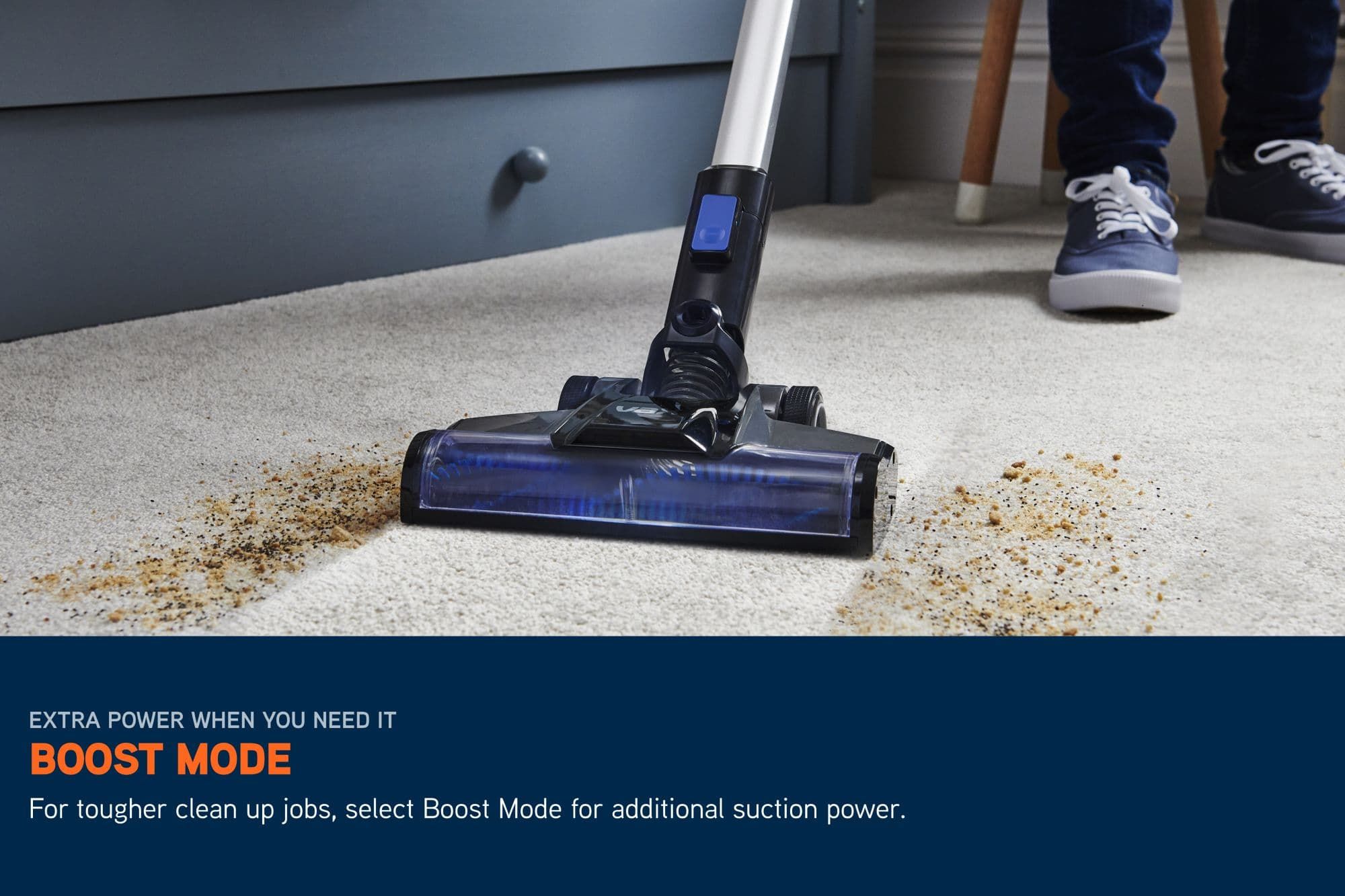 Pace Cordless Vacuum cleaning up a large spilt mess off of the carpet using boost mode. Text reads: boost mode for tougher clean up jobs, select Boost Mode for additional suction power. 