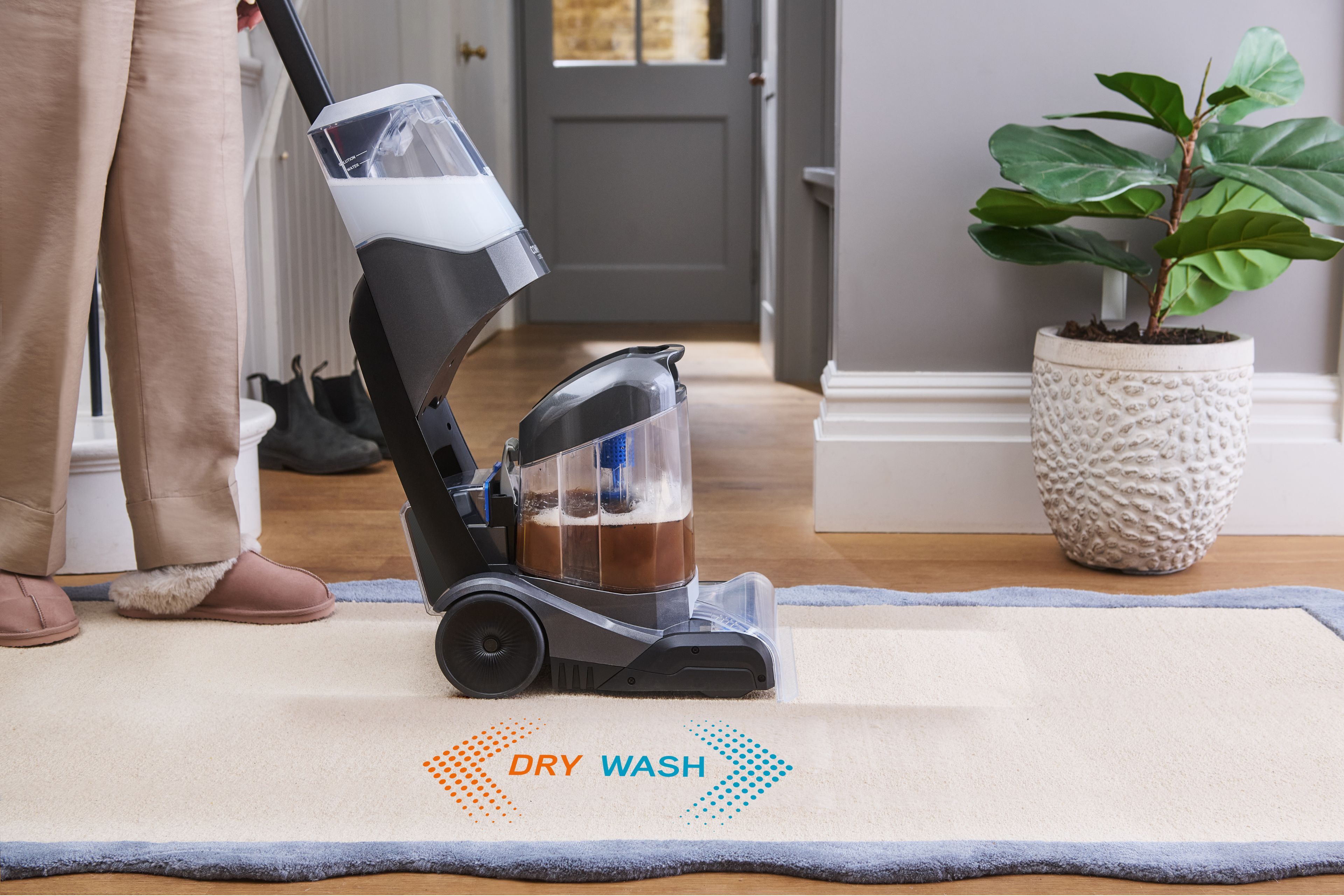 VAX ONEPWR Compact Cordless Carpet Cleaner washing carpet on forward push and drying on backward pull