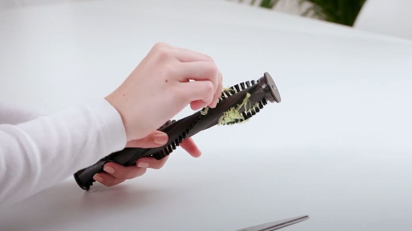 Pull debris from brushbar